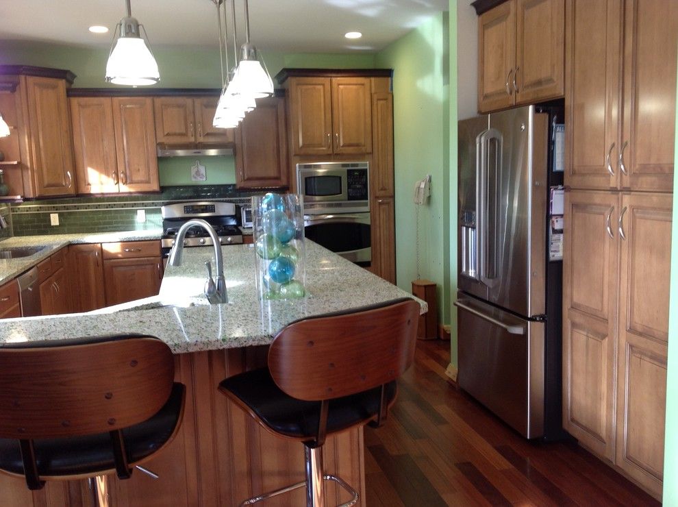 Queen City Appliance for a Eclectic Kitchen with a Pendant Lighting and Vetrazzo Island by Avalon Kitchen