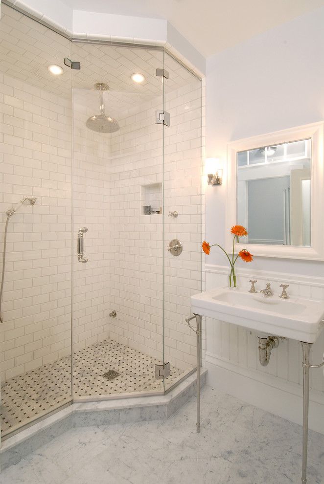 Radiant Plumbing for a Traditional Bathroom with a Basketweave Tile and Greek Revival Bath with Transom Windows by Charlie Allen Renovations, Inc.