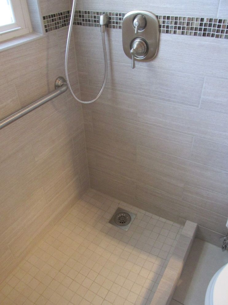 Redi Floors for a Contemporary Spaces with a Large Format Floor Tile and Small Bathroom Remodel & Tub Replacement by Contemplative Construction, L.l.c.