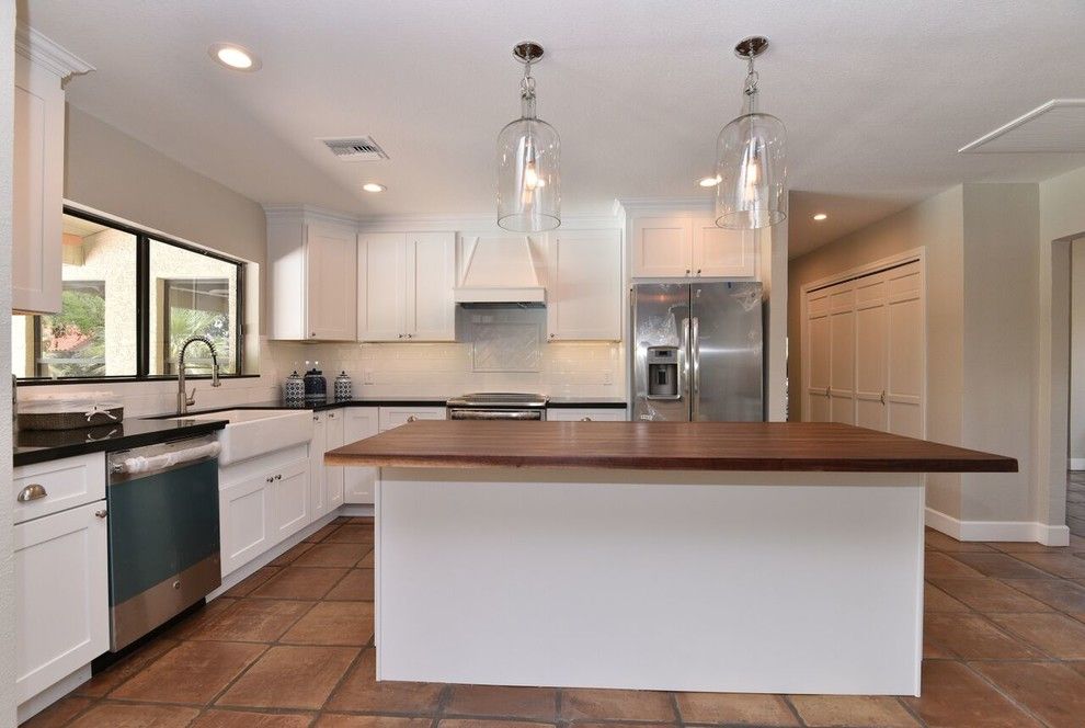 Reef Builders for a Traditional Spaces with a Butcher Block Countertop and Poinsetta   Complete Remodel by Reef Builders Llc