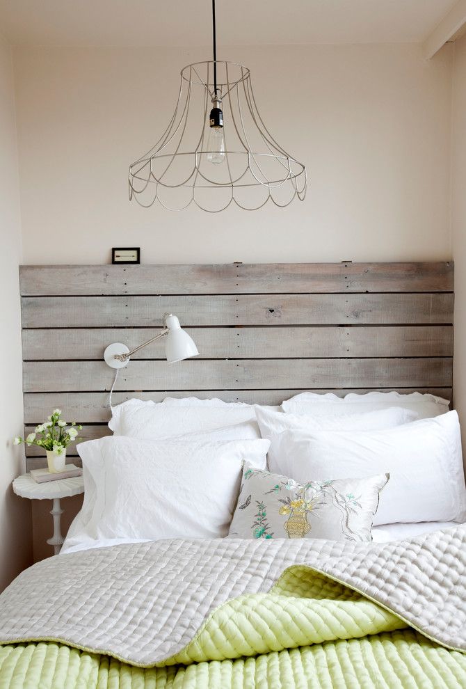 Repurposed Pallets for a Shabby Chic Style Bedroom with a Repurposed Wood Headboard and West End Studio by the Cross Interior Design