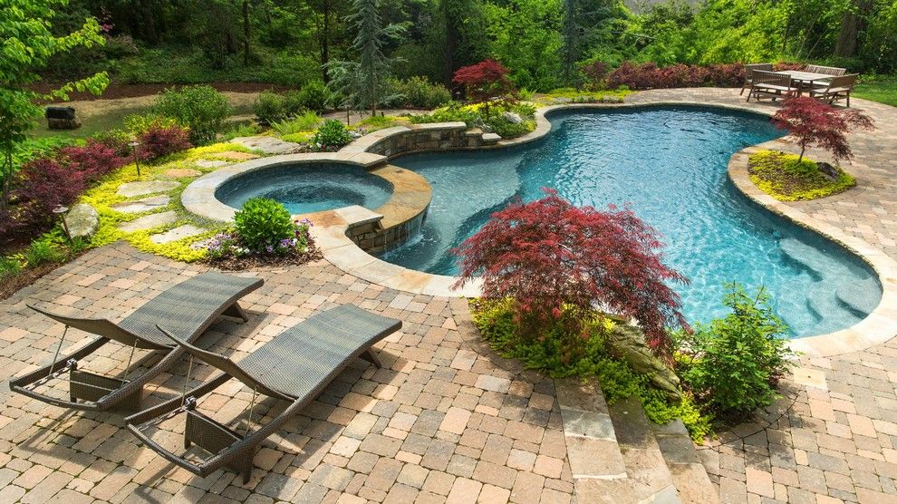 Rising Sun Pools for a Traditional Pool with a Round Spa and Pools by Landscape Studio