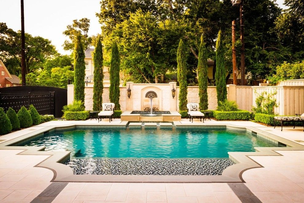 Rising Sun Pools for a Traditional Pool with a Wet Deck and Elegant by Pool Environments, Inc.