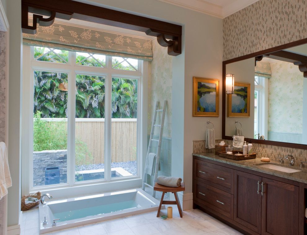 Roman Tub for a Transitional Bathroom with a Wood Framed Mirror and Tranquil Eclectic Residence by Deakins Design Group