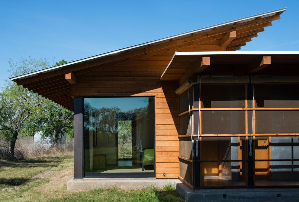 Roof Overhang for a Modern Exterior with a Screened Porch and Big Tree Camp by Progressive Solutions / Renaissance Bronze Windows