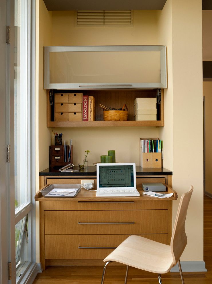 Rudy Furniture for a Midcentury Home Office with a Wood Floor and Mid Century Remodel by Lucy Johnson Interior Design