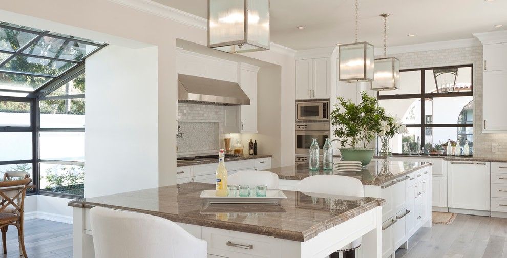 Santa Cecilia Light Granite for a Mediterranean Kitchen with a Glass Ceiling and Santa Monica by Sinclair Associates Architects