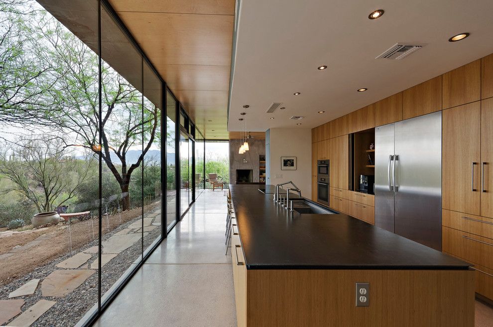 Schmitt Furniture for a Modern Kitchen with a Double Sided Island and Camino De Oeste Residence by Repp + Mclain Design and Construction