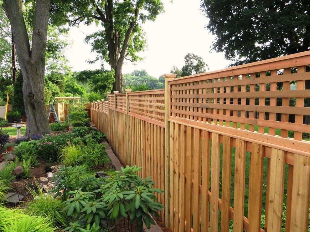 Shadowbox Fence for a Contemporary Exterior with a Backyard Retreat and Western Red Cedar Shadowbox with Lattice Top by the Fence Experts