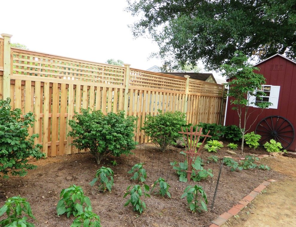 Shadowbox Fence for a Contemporary Exterior with a Lattice Fence and Western Red Cedar Shadowbox with Lattice Top by the Fence Experts