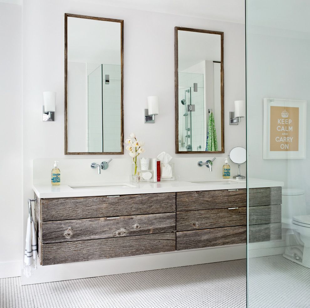 Shell Lumber for a Transitional Bathroom with a Distressed Wood Floating Cabinets and City Homes by Jennifer Worts Design Inc.