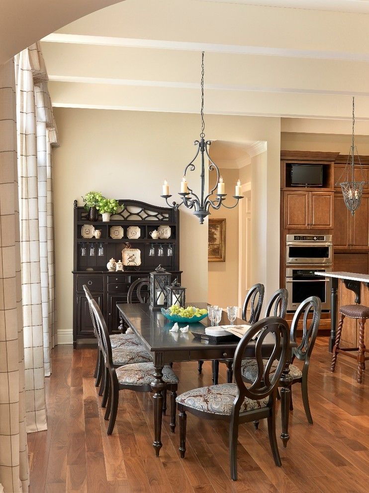 Sherwin Williams Kilim Beige for a Traditional Dining Room with a Black China Cabinet and President's House Lindenwood University by Mitchell Wall Architecture & Design