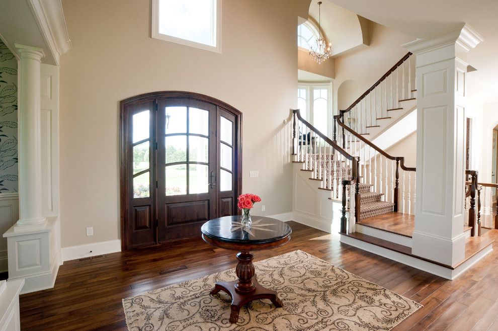 Sherwin Williams Kilim Beige for a Traditional Entry with a Column and Medina Luxury Home by Schrader & Companies