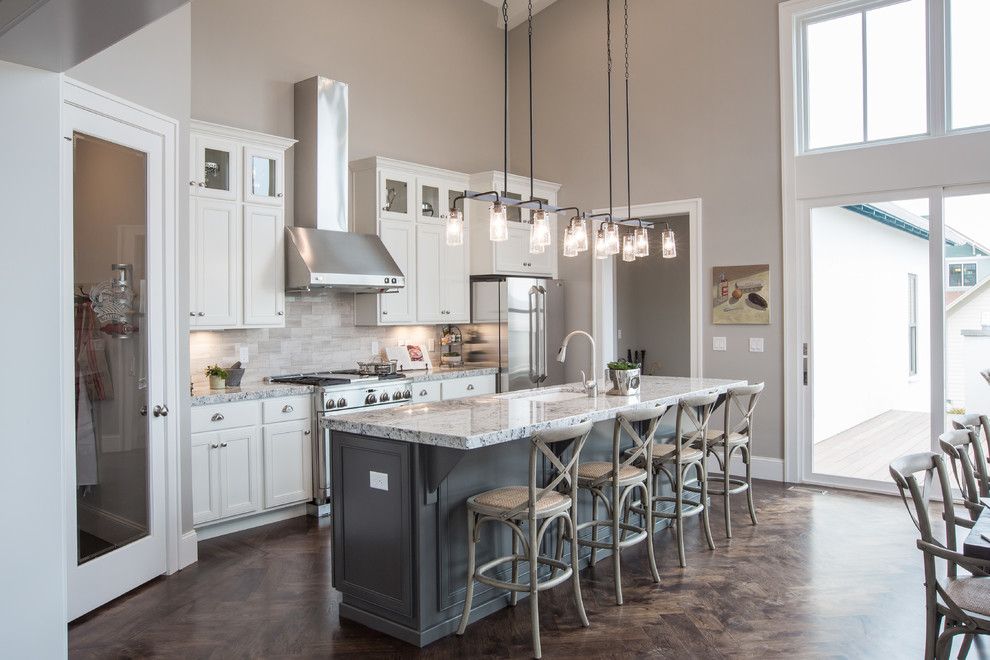 Sherwin Williams Kilim Beige for a Traditional Kitchen with a Herringbone Floor and Traditional Kitchen by Andreawestdesign.com