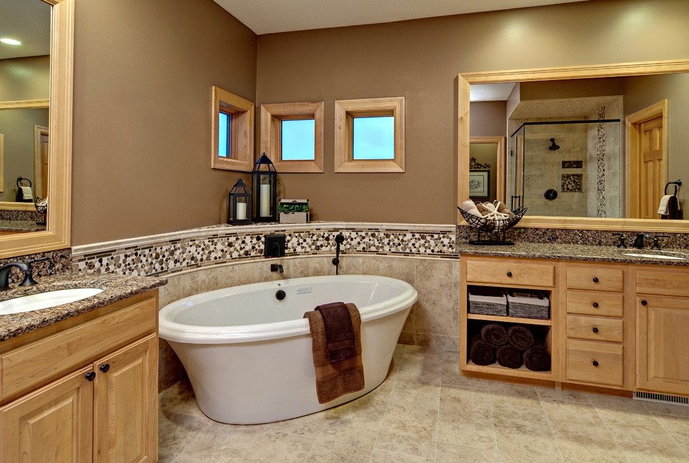 Sherwin Williams Latte for a Contemporary Bathroom with a Large Mirror and Master Bath by Lori Handberg Designs