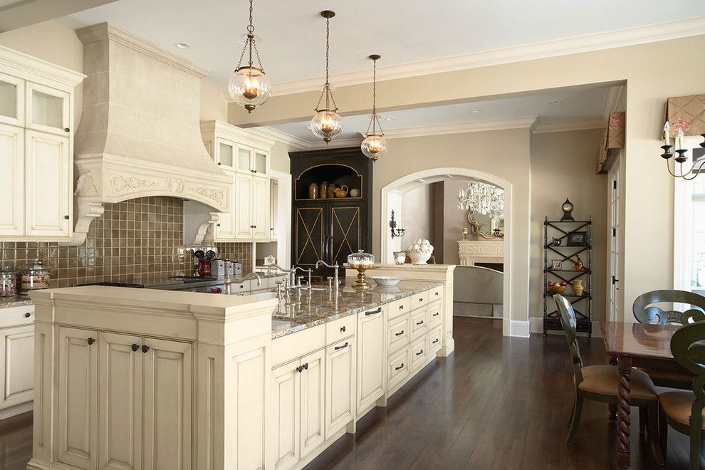 Sherwin Williams Macadamia for a Traditional Kitchen with a Chandelier and Kitchen View of the Island From the Sitting Area by Erotas Building Corporation