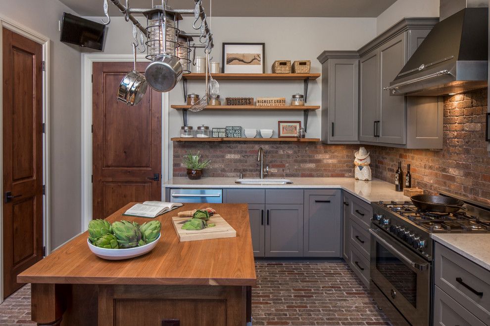 Sherwin Williams Repose Gray for a Transitional Kitchen with a Hanging Pots Rack and Central Texas Custom Home by Dawn Hearn Interior Design