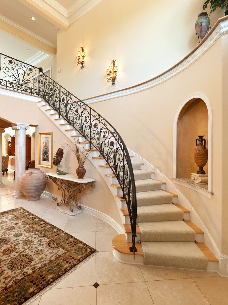 Sherwin Williams Softer Tan for a Mediterranean Staircase with a Column and the Mediterranean Custom Home by Carstensen Homes