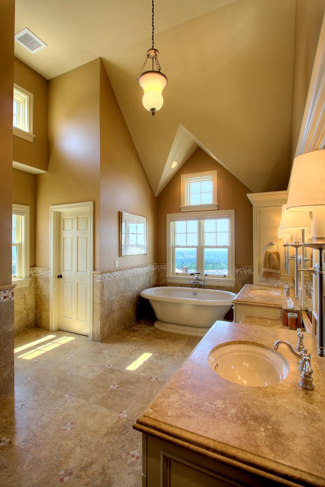 Sherwin Williams Softer Tan for a Traditional Bathroom with a Soaker Tub and Issaquah Highlands Residence by Hilary Young Design Associates