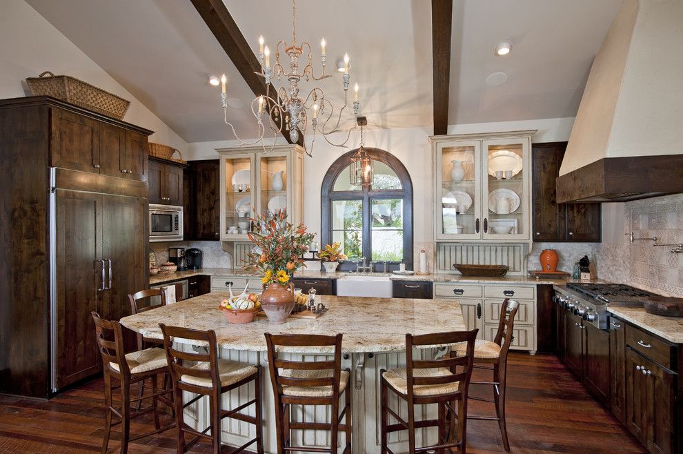 Shiloh Cabinets for a Mediterranean Kitchen with a Arched Window and Great Kitchens by Jenkins Custom Homes