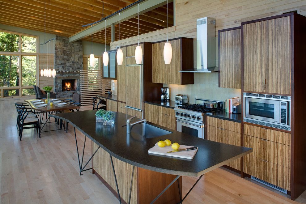 Shoreline Flooring for a Modern Kitchen with a Wood Floor and Eagle Harbor Cabin by Finne Architects