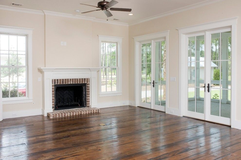 Shoreline Flooring for a Traditional Living Room with a Reclaimed Wood Floors and the Jekyll by Shoreline Construction and Development