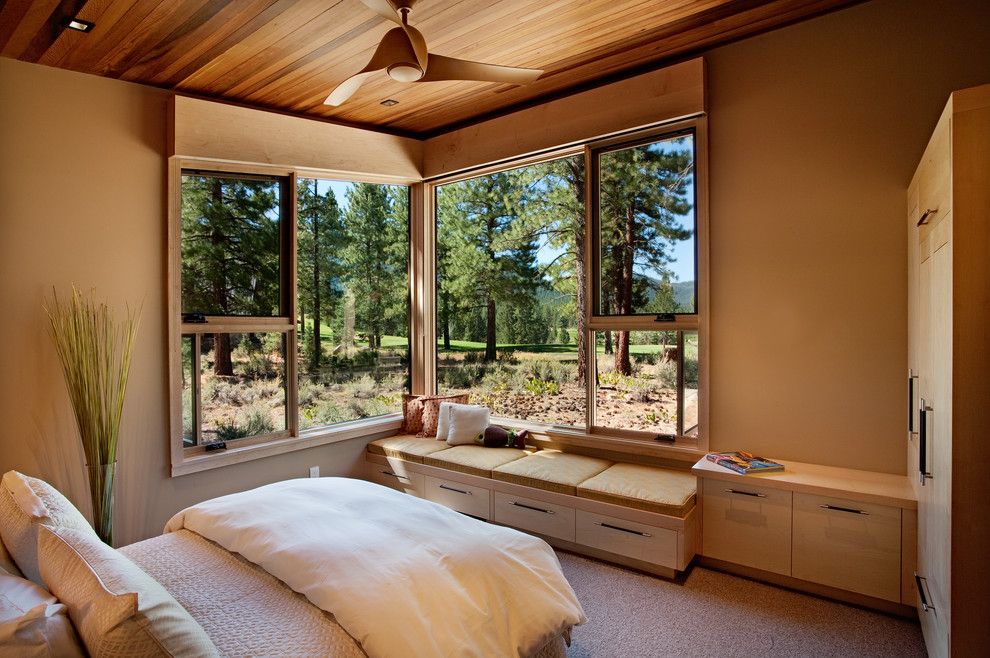 Sierra Pacific Windows for a Rustic Bedroom with a Storage Bench and Bedroom 02 by Ryan Group Architects