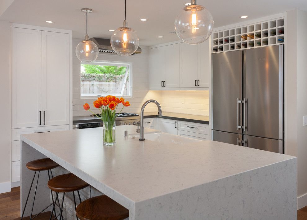 Silestone Lagoon for a Contemporary Kitchen with a Pendant Fixture and Balboa Coves Remodel by Eric Aust Architect