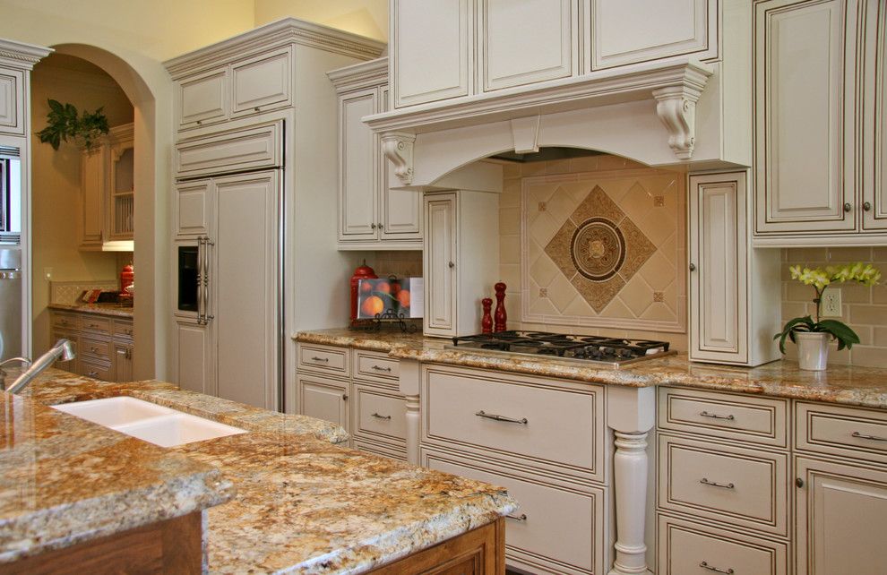 Silestone vs Granite for a Traditional Kitchen with a Cookbook Stand and Landmark Builders by Landmark Builders