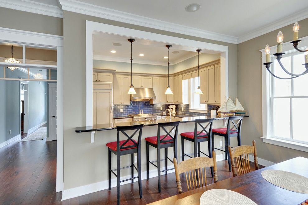 Silver Sage Paint for a Traditional Kitchen with a White Painted Trim and Kitchen by Echelon Custom Homes