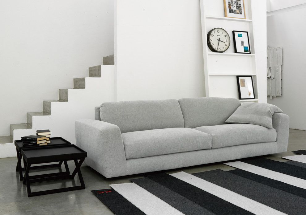 Simplicity Sofas for a Modern Family Room with a Wall Clock and Modular Sofa 05226 by Usona