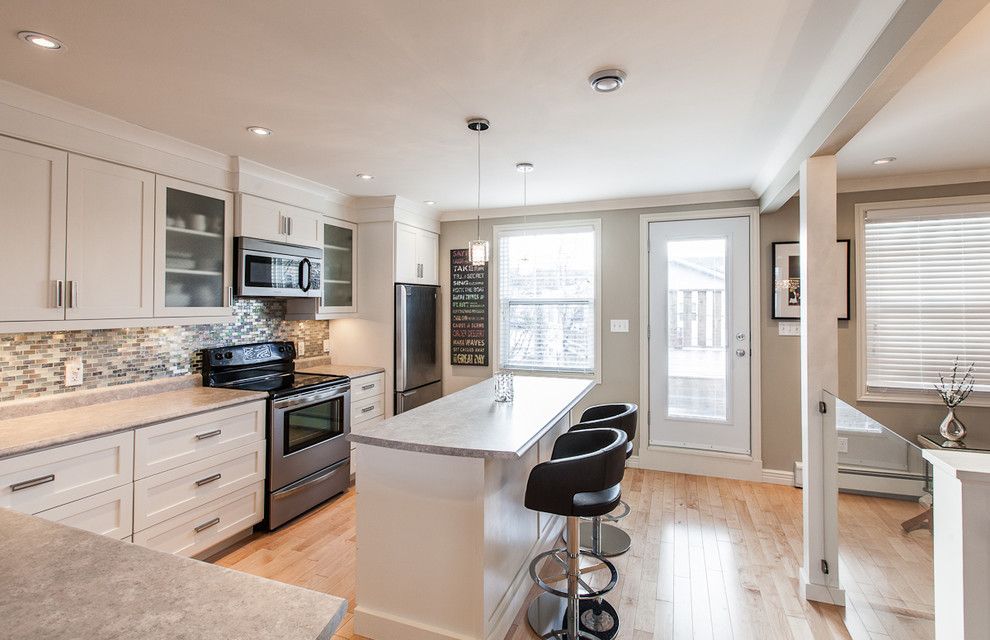 Singing River Electric for a Contemporary Kitchen with a Wood Floor and My Houzz: Open Concept Apartment Above Retail in Downtown St. John's by Becki Peckham