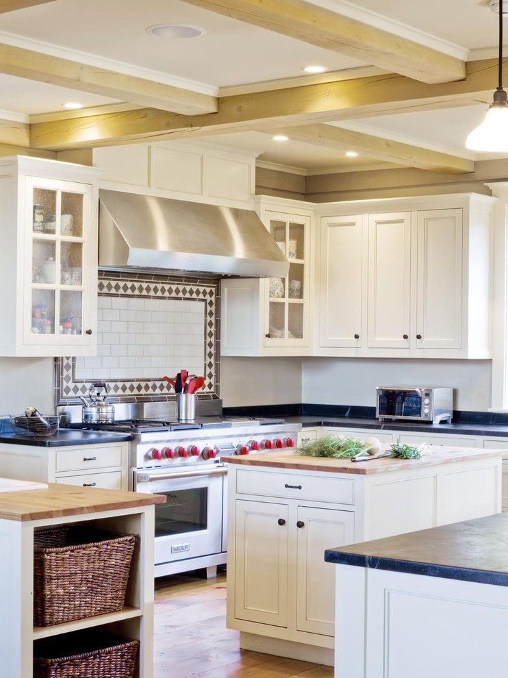 Soap Stone for a Farmhouse Kitchen with a Range Hood and Farmhouse Revival by Cushman Design Group