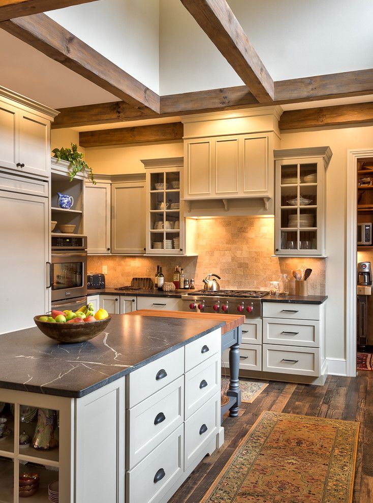 Soap Stone for a Farmhouse Kitchen with a Wood Beams and Pennsylvania Farmhouse Inspired Kitchen by Benbow & Associates