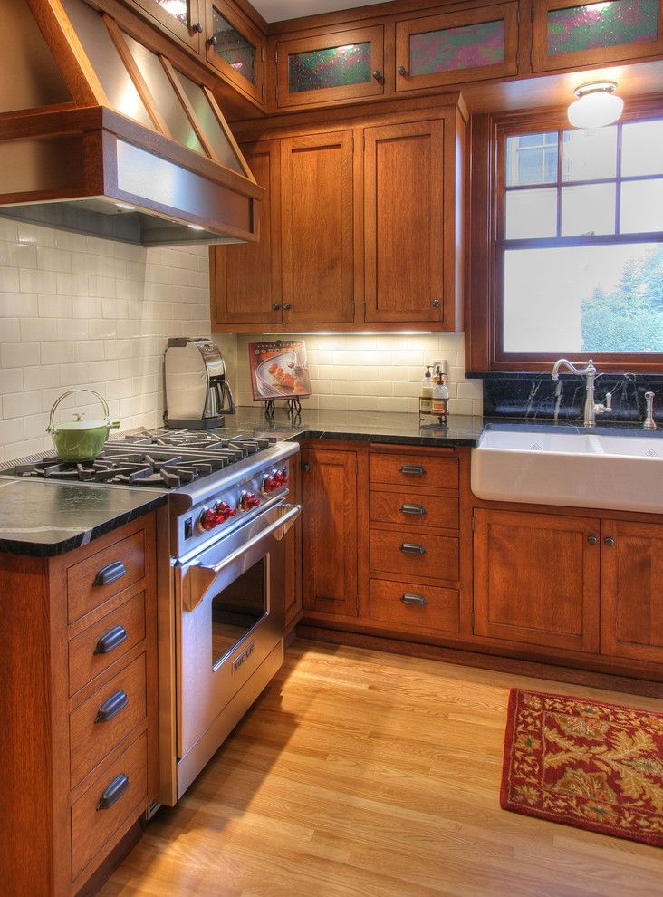 Soapstone vs Granite for a Craftsman Kitchen with a Wainscot and Craftsman Kitchen by W.b. Builders