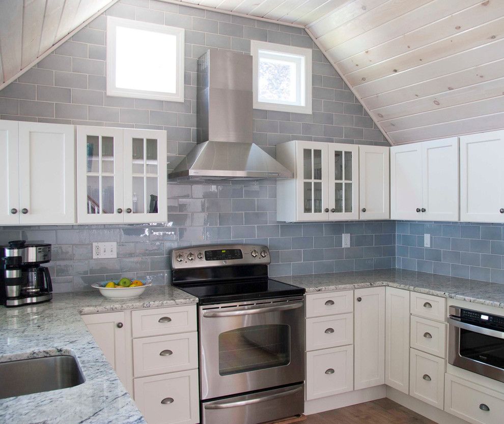 Sonoma Tile for a Beach Style Kitchen with a Whitewashed Ceiling and Beach House Renovation by Judy Cook Interiors, Llc