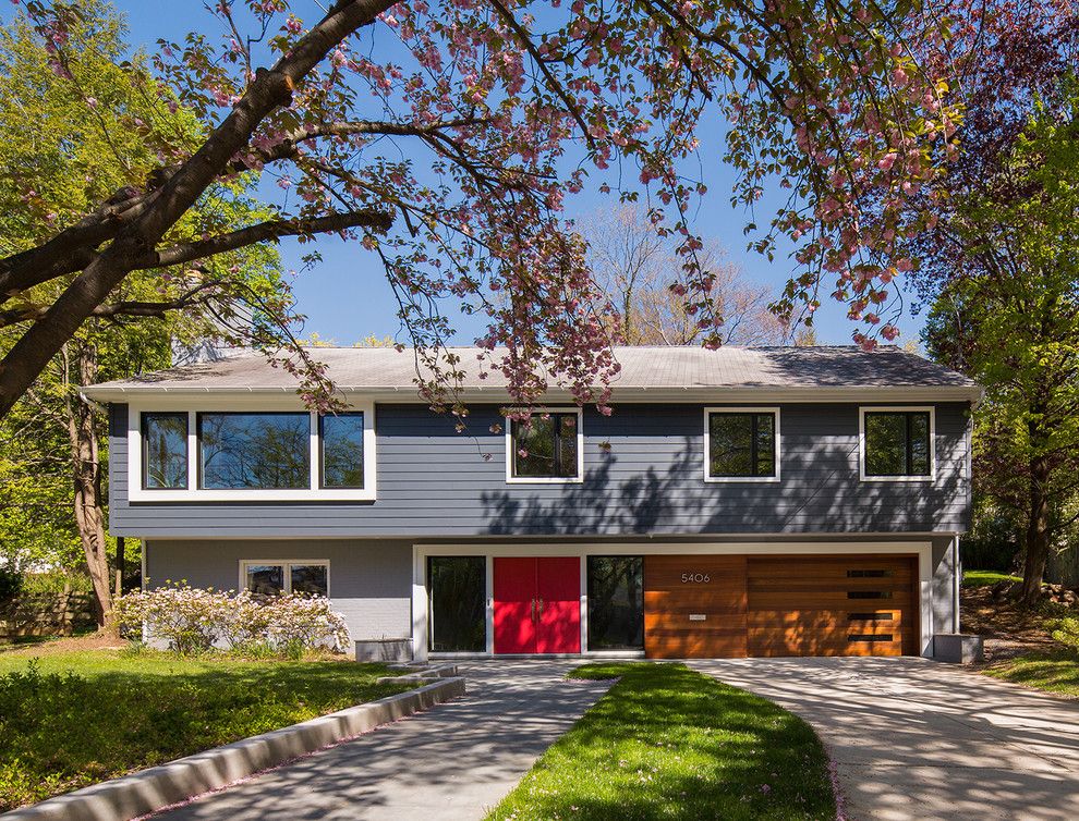 Split Level Remodel for a Midcentury Exterior with a Grey Painted Stone and Somerset Renovation by Balodemas Architects