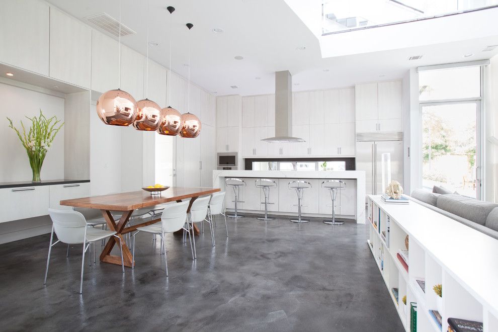 Stained Concrete Floors for a Contemporary Kitchen with a Trestle Table and Memorial Park Modern by Laura U, Inc.