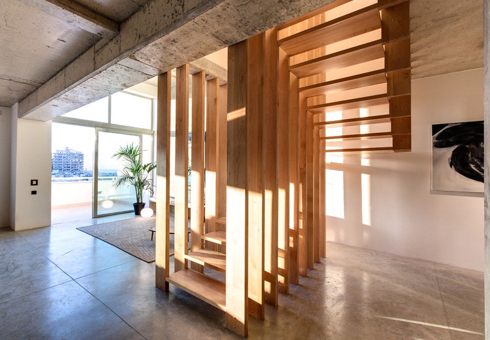 Stained Concrete Floors for a Contemporary Staircase with a Entry and Pjazza Tigne by Chris Briffa Architects