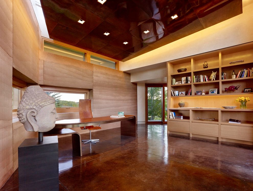 Stained Concrete Floors for a Modern Home Office with a Leather Task Chair and Trader Office Addition by Carney Logan Burke Architects
