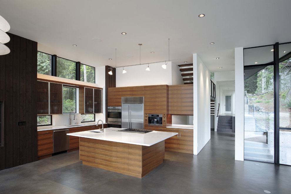 Stained Concrete Floors for a Modern Kitchen with a Wood Cabinets and David Vandervort Architects Aia by David Vandervort Architects