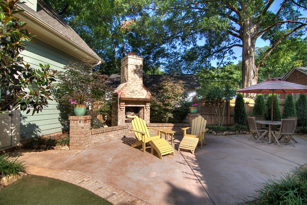 Stained Concrete Patio for a Traditional Patio with a Plants and Chantilly Cottage by Grandfather Homes