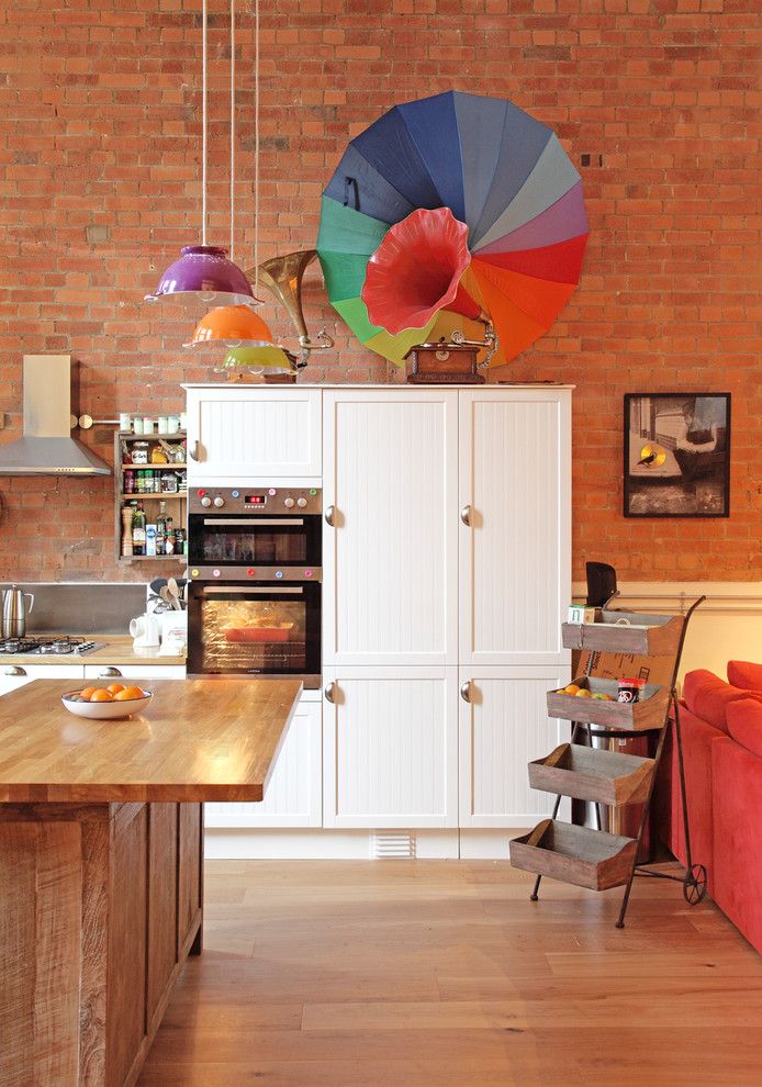 Staining Brick for a Eclectic Kitchen with a Colourful Pendant Light and Eclectic Stoke Newington Apartment by Avocado Sweets Interior Design Studio