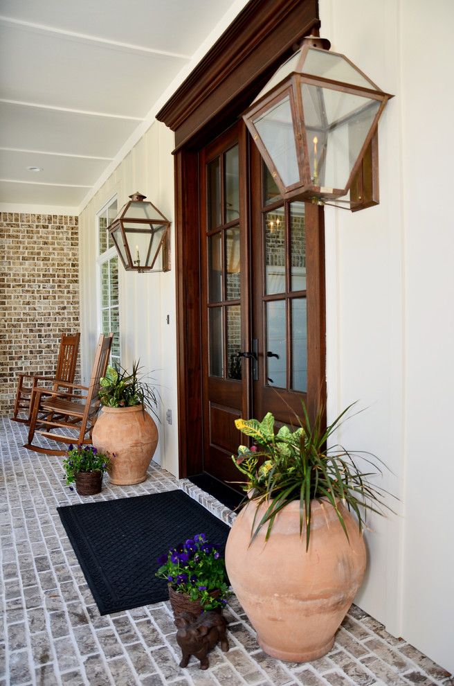 Staining Brick for a Traditional Entry with a Outdoor Potted Plant and Pensacola Waterfront by Sprague Construction