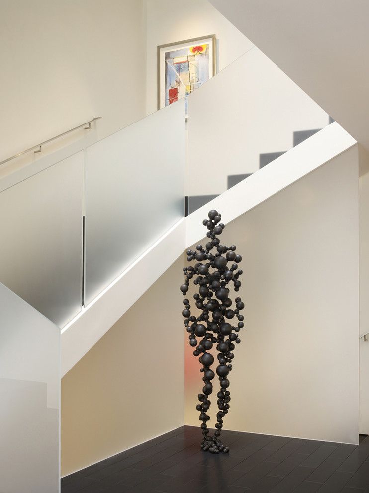 Starfire Glass for a Contemporary Staircase with a Dark Floor and Cow Hollow Modern by Matarozzi Pelsinger Builders