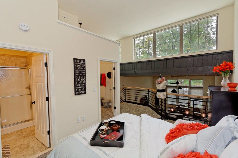 Stark Carpet for a Industrial Bedroom with a Wood Paneling and Window Factory Lofts by Viscusi Builders Ltd.