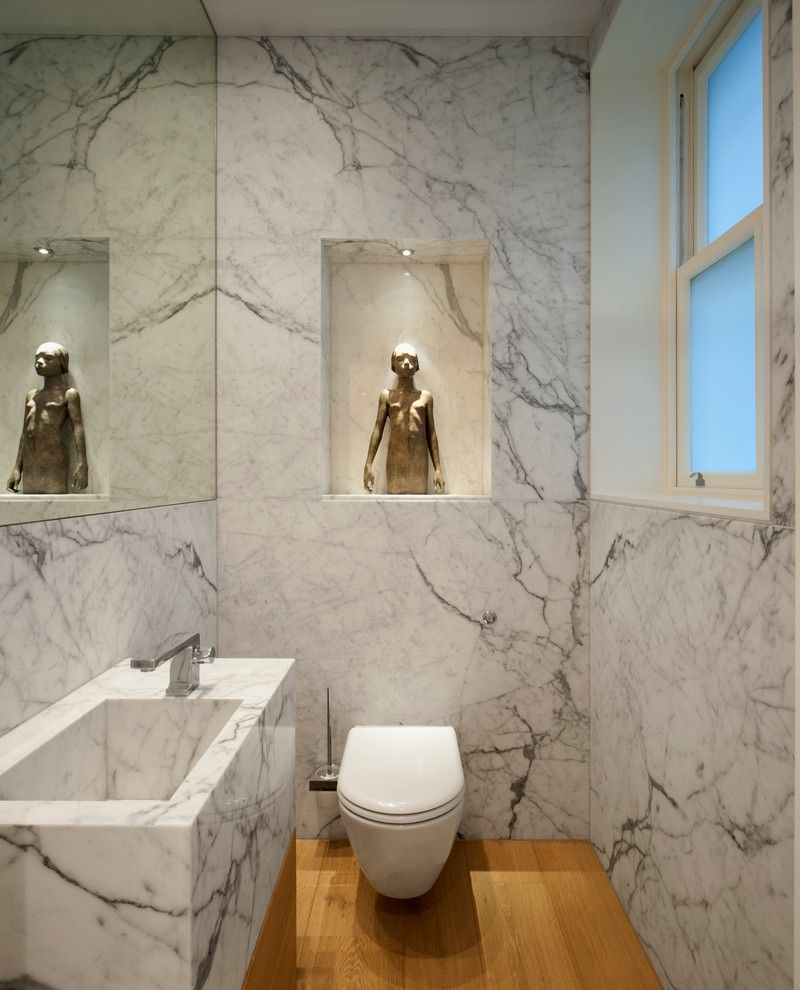 Statuary Marble for a Contemporary Powder Room with a Marble Bathroom and Luxury Apartment in Queen's Gate by Tg Studio