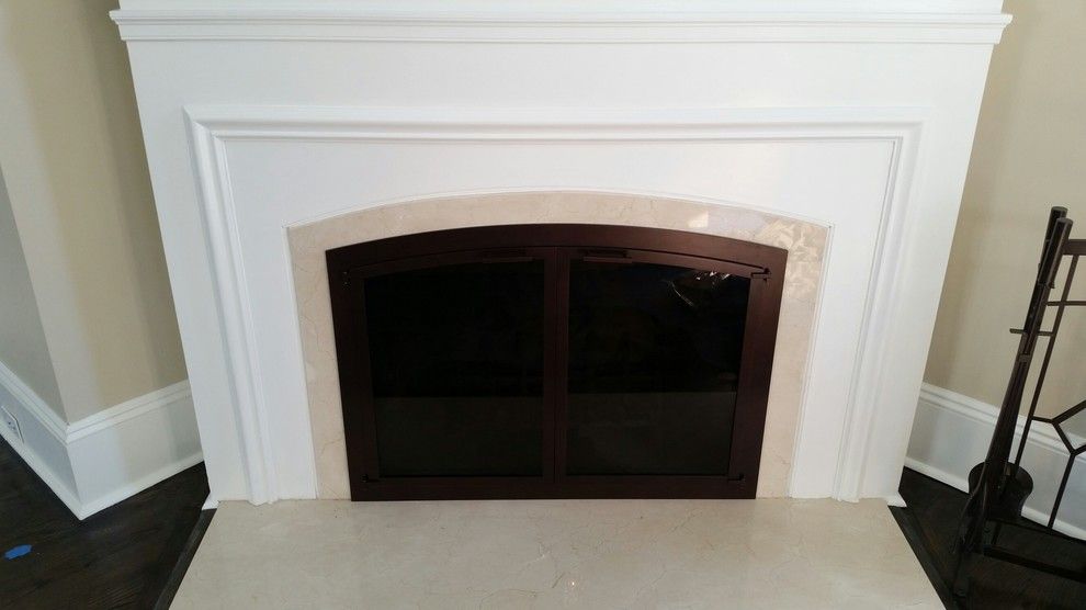 Stoll Fireplace for a Traditional Living Room with a Arch Door and Glen Rock Door by Kjb Fireplaces