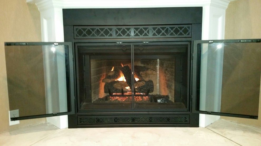 Stoll Fireplace for a Traditional Living Room with a Fireplace Door and Norwood Before & After Door by Kjb Fireplaces