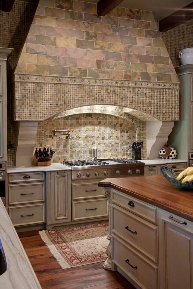 Stone Mart Tampa for a Mediterranean Kitchen with a Stone Backsplash and Odessa House by Gage Martin Interiors